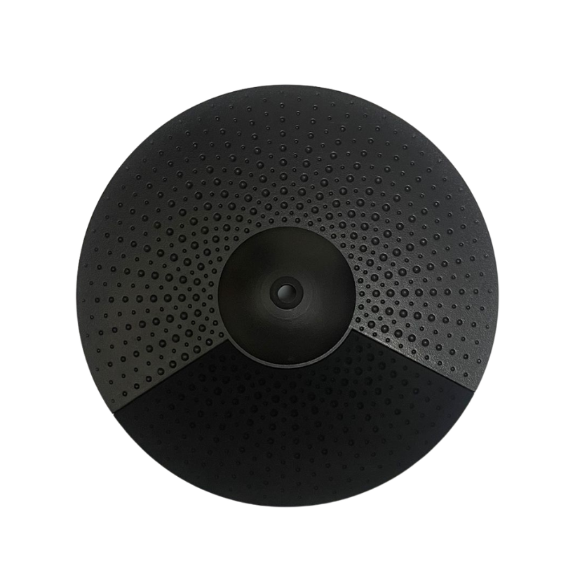 Black circular object with textured surface on a white background