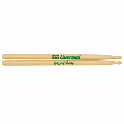 Two wooden drumsticks with 'Liverpool Gospel Chops' branding on a white background