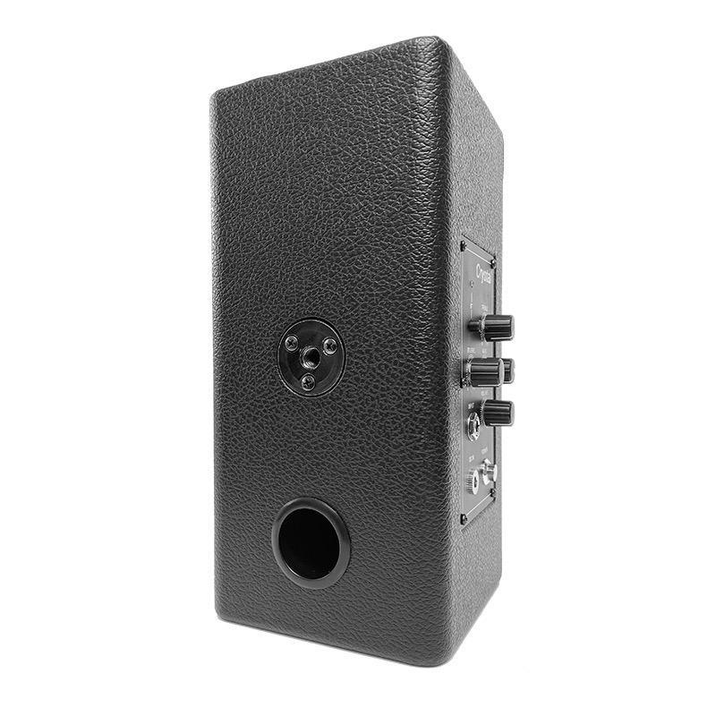 Black electronic device with control knobs on a white background