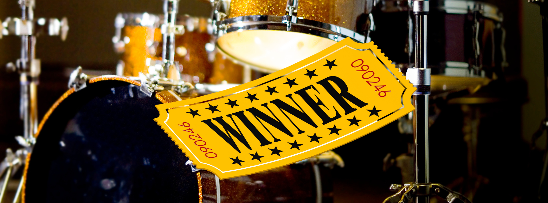 Drums with a 'Winner' sign in a music studio setting